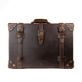 High quality dark brown leather luggage front view.
