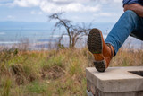 High quality lifestyle image of the Huntsman boot in natural patina