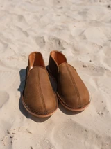 High quality lifestyle image of the barefoot slip on shoe