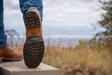 High quality lifestyle image of the Huntsman boot in natural patina