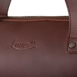 High quality up close look at the logo in red brown