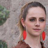 model image of the red leather feather earrings