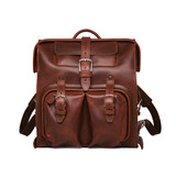High quality front of the red brown big mouth leather backpack with two front pockets and two side pockets. Made by Saddleback