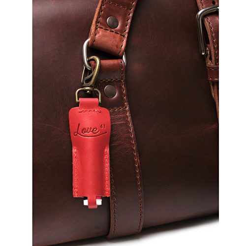 This is the red chapstick holder shown attached to a bag