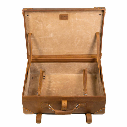 High quality inside of the tan colored medium suitcase. Includes straps inside to securely hold anything in place. Made by Saddleback
