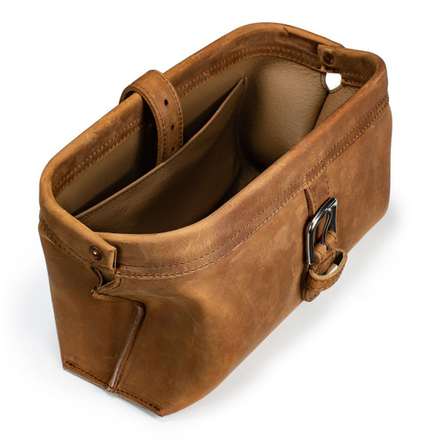 This is a tan brown leather toiletry bag from the top angled.