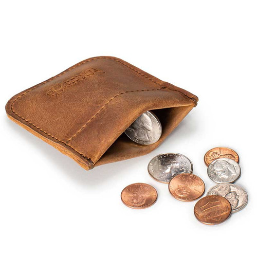 High quality tan brown leather coin purse that has change spilling out in front of the pouch.