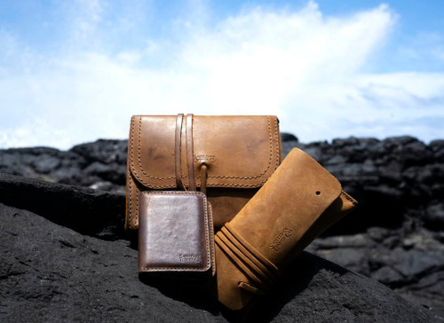 High quality the cash and receipt leather bag with our other wallet and organizer out by the beach. Made by Saddleback