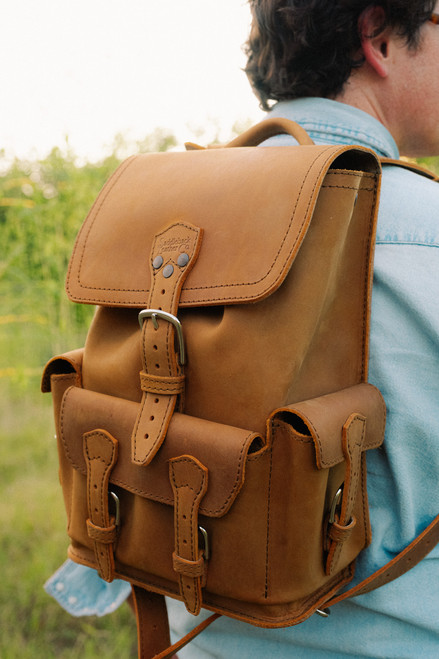 High quality front pocket backpack in light brown on a models back