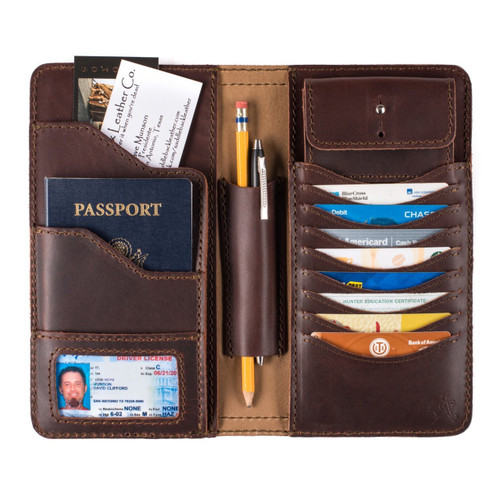 High quality inside of a red brown really large leather wallet.