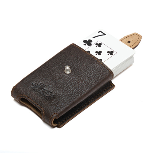High quality leather deck holder opened with a deck of playing cards coming out. Made by Saddleback