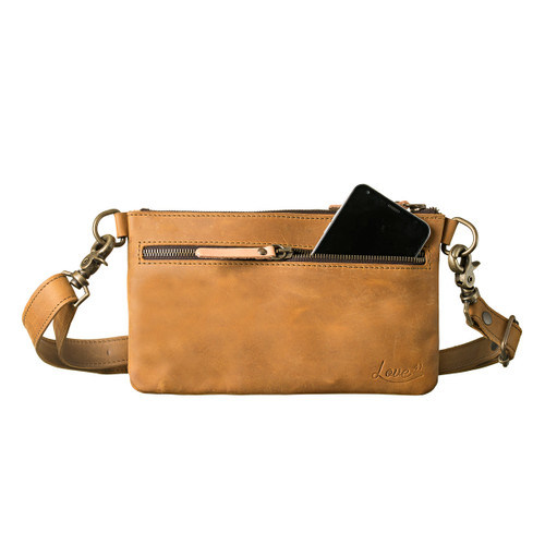 This light tan colored leather belt bag is showing the front view