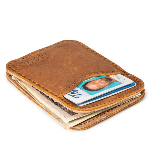 High quality tan brown leather wallet laying down.