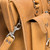 High quality front pocket of a light brown tan leather briefcase for lawyers.
