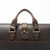High quality side view of the flight bag leather briefcase in dark brown showing the shoulder strap and two handles for easy carry. Made by Saddleback