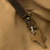 High quality key clip view of the leather all in one backpack in dark coffee