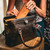 High quality a leather purse with a Gladstone closure shown open.