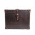 High quality front of the dark brown leather small trunk showing off the buckle that keeps your trunk shut and the rivets on the corners, displaying the care each piece was given. Made by Saddleback
