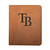 High quality tan colored leather portfolio with the Tampa Bay Rays logo on the front. Made by Saddleback