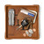 High quality tan colored leather valet tray that is holding a wallet, keys, change, and pocket knife. Made by Saddleback