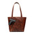 High quality the view of a gun inside our red brown conceal carry leather tote