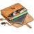 High quality slim leather briefcase laid on its side with all that it can hold spilling out.