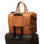High quality view of the double compartment leather duffle in tan with luggage rack
