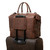 High quality view of the double compartment leather duffle in dark coffee with luggage rack