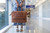 High quality lifestyle image of our tan compartment leather duffle