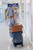 High quality lifestyle image of our tan compartment leather duffle