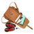 High quality tan brown leather backpack that is spilled out to see what fits.
