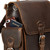 This is the side pocket behind the pocket of a dark brown leather backpack.