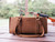 High quality lifestyle image of our light brown range and tool leather tote