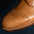 High quality broguing detail shown on natural leather boots by Saddleback.