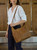High quality lifestyle image of the hobo leather purse