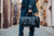 High quality lifestyle view of the Wesley Deep Pocket Duffle in Italian Black Leather