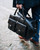 This is the lifestyle view of the Wesley Deep Pocket Duffle in Italian Black Leather