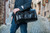High quality lifestyle view of the Wesley Deep Pocket Duffle in Italian Black Leather
