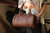 High quality lifestyle image of the everyday barrel leather purse