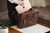 High quality lifestyle image of the women's business leather satchel in dark brown