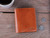 This is the lifestyle image of the Silverback Large Bifold Wallet in light tan