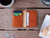 High quality lifestyle image of the Silverback Slim Bifold leather Wallet in Light tan