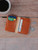 This is a lifestyle image of the Silverback Slim Bifold Wallet in Light tan