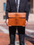 High quality lifestyle image of the document leather holder in tan