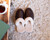High quality lifestyle image of the dark brown sheepskn slippers