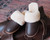 High quality lifestyle image of the womens dark brown sheepskin slippers
