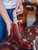 High quality wooden shoe tree being inserted into a reddish-brown leather officer boot - Saddleback Leather