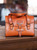 High quality lifestyle image of the silverback handle leather purse