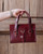 High quality lifestyle image of the silverback handle leather purse
