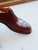 High quality close-up of red brown full grain leather wing tip shoe medallion toe cap brogue pattern - Saddleback Leather